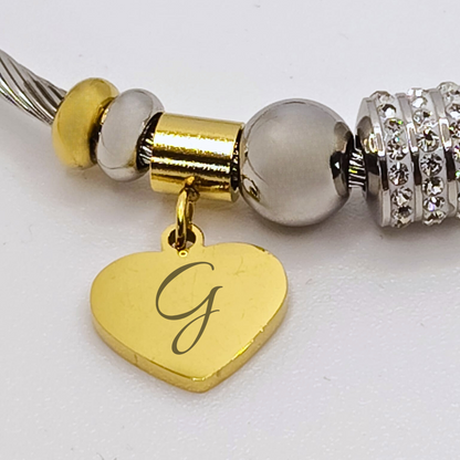 "Charme d’Amore" – Bracciale Personalizzabile con Iniziale e Cuore Brillante